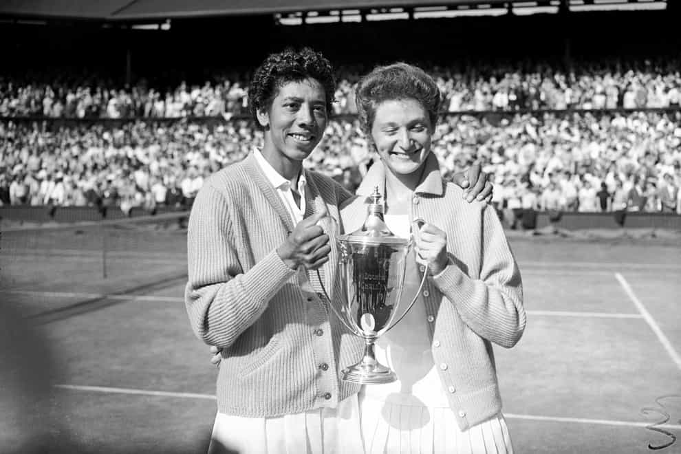 Angela Buxton (right) pictured with her tennis partner Althea Gibson celebrating their Wimbledon title in 1956