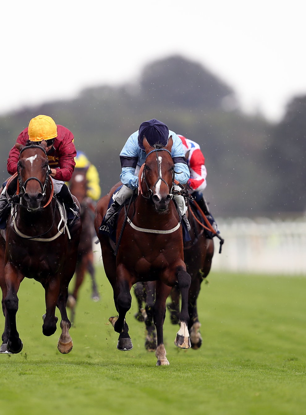 Gear Up (centre) claims Spycatcher close home to win the Tattersalls Acomb Stakes at York