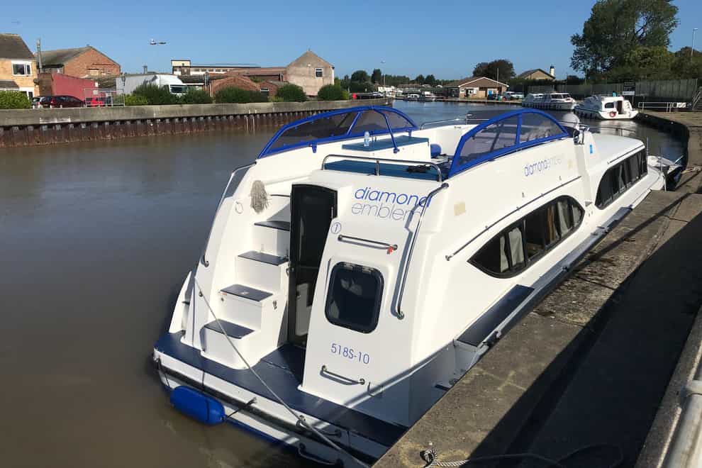 A woman, aged in her 30s and from the London area, died after she got trapped under a boat near to Great Yarmouth Yacht Station. Emergency efforts appeared to focus on a 42ft-long Broads cruiser called Diamond Emblem. (Sam Russell/ PA)