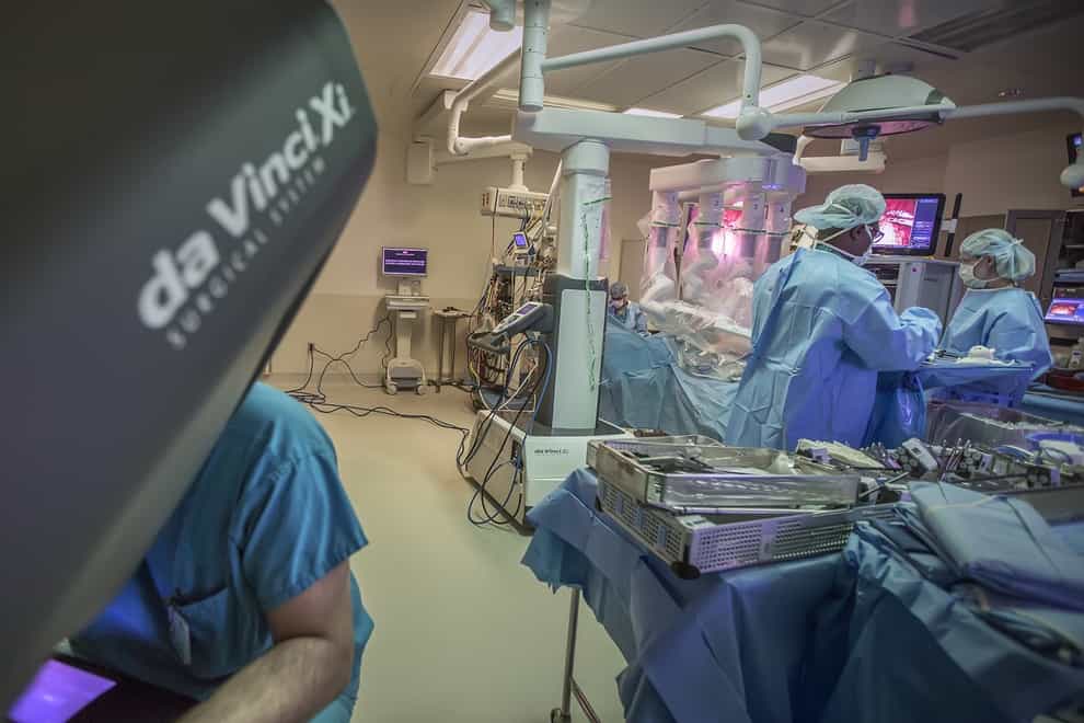 Surgeons perform robotic surgery