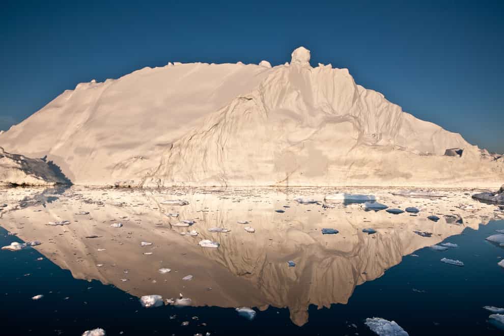 An iceberg and its reflection in Disko Bay, Greenland,