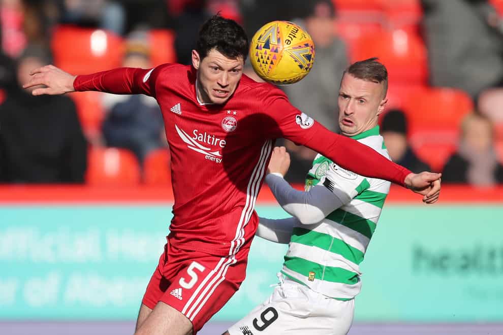 Aberdeen’s Scott McKenna (left) is back from self-isolation and ready to face Livingston.