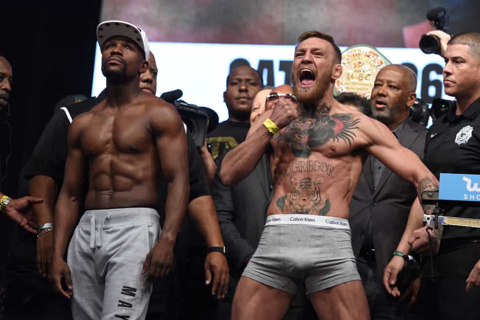 Floyd Mayweather Jr and Conor McGregor, right, during the weigh in before 'The Money Fight' in Las Vegas in 2017