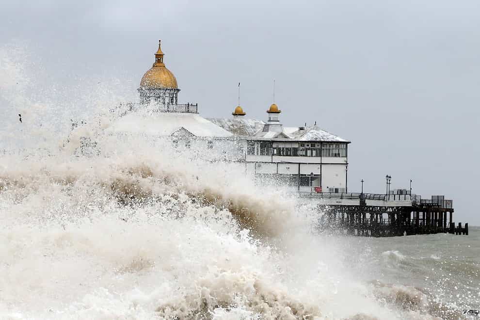 Waves crash near the pier in Eastbourne, East Sussex