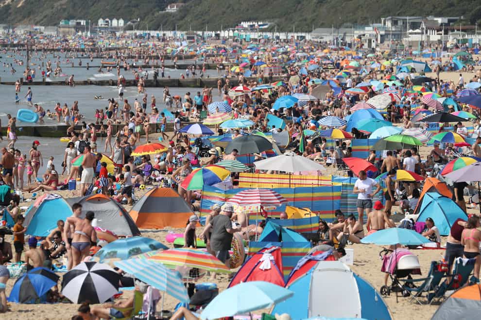People enjoy the hot weather on the beach at Bournemouth