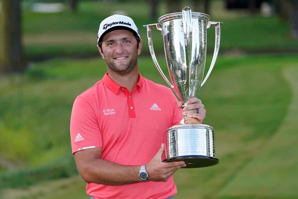Jon Rahm poses with the J.K. Wadley trophy after winning the BMW Championship golf tournament at the Olympia Fields Country Club