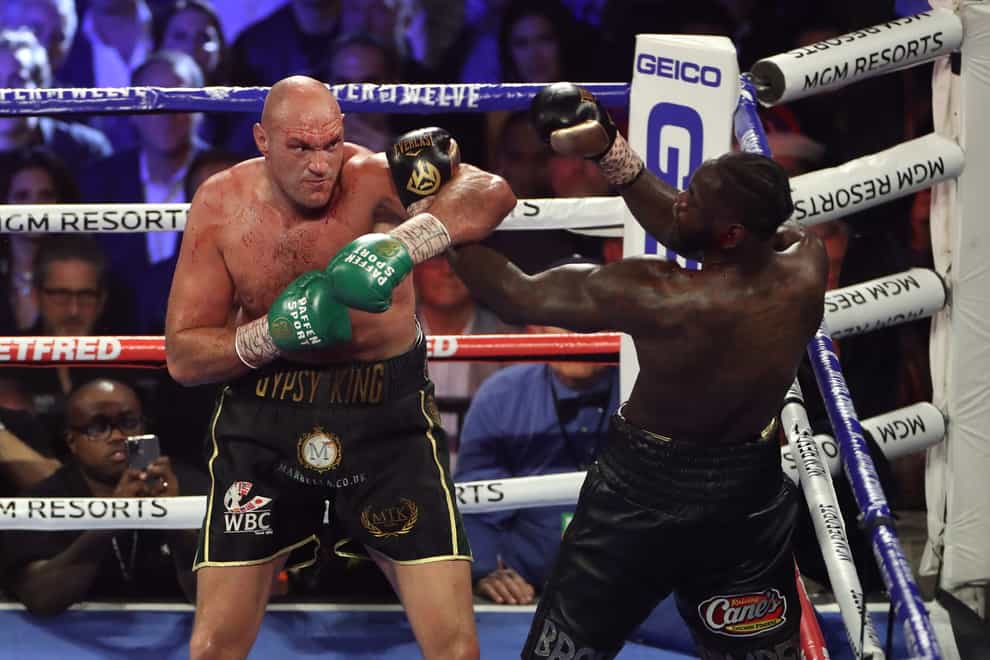 Tyson Fury, left, is committed to a third fight against Deontay Wilder (Bradley Collyer/PA)