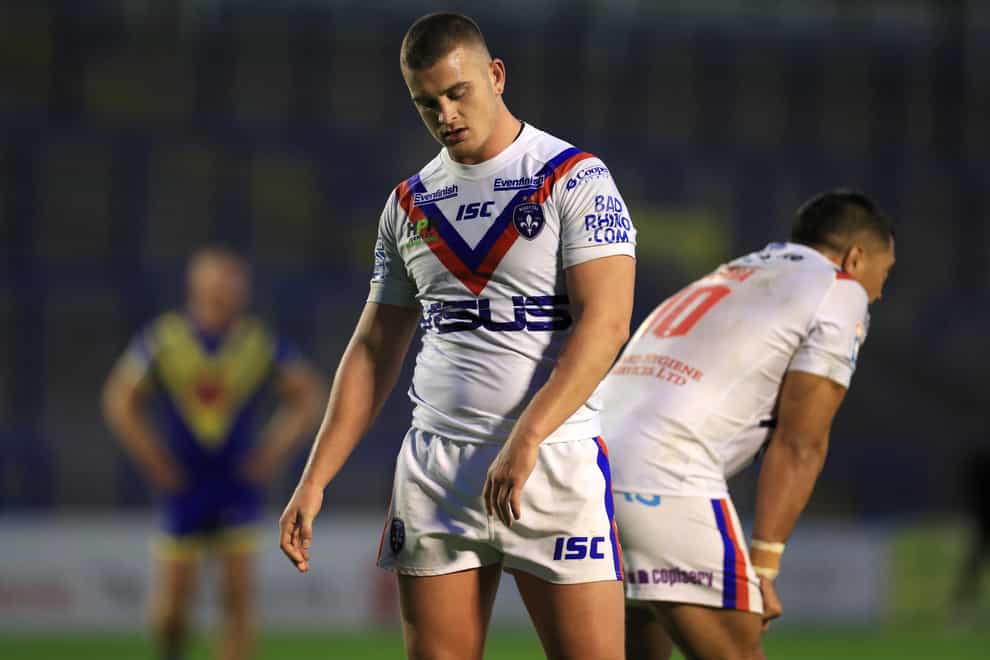 Wakefield's Super League match against Leeds Rhinos has been postponed after two Wakefield players tested positive for coronavirus.
