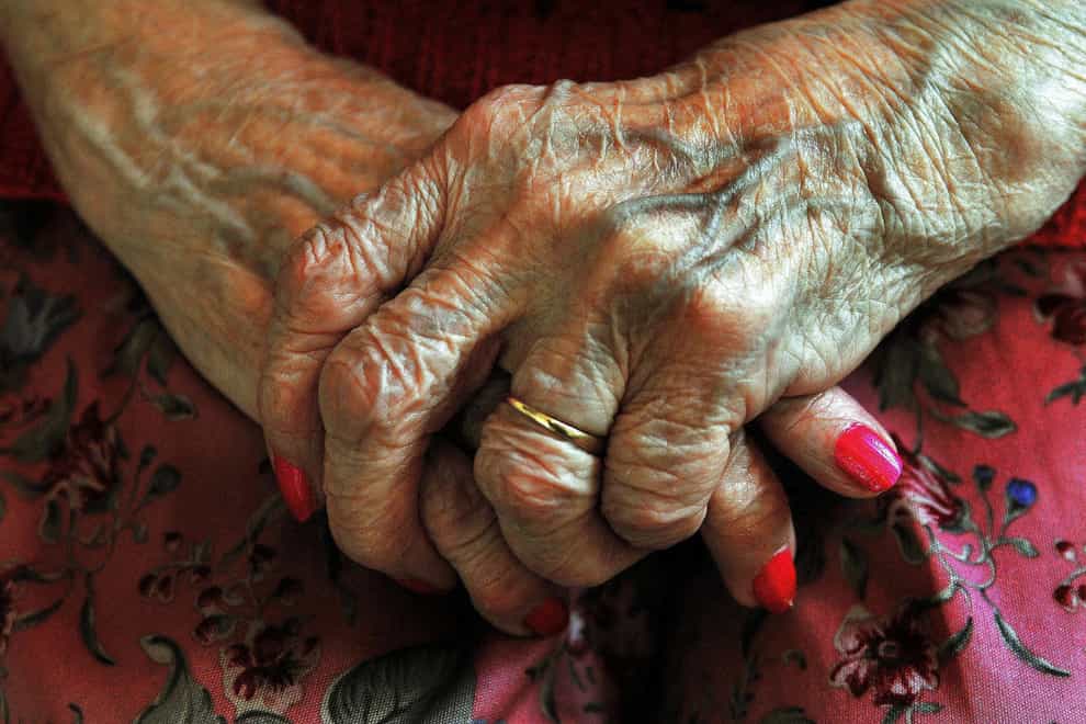 An elderly woman's hands