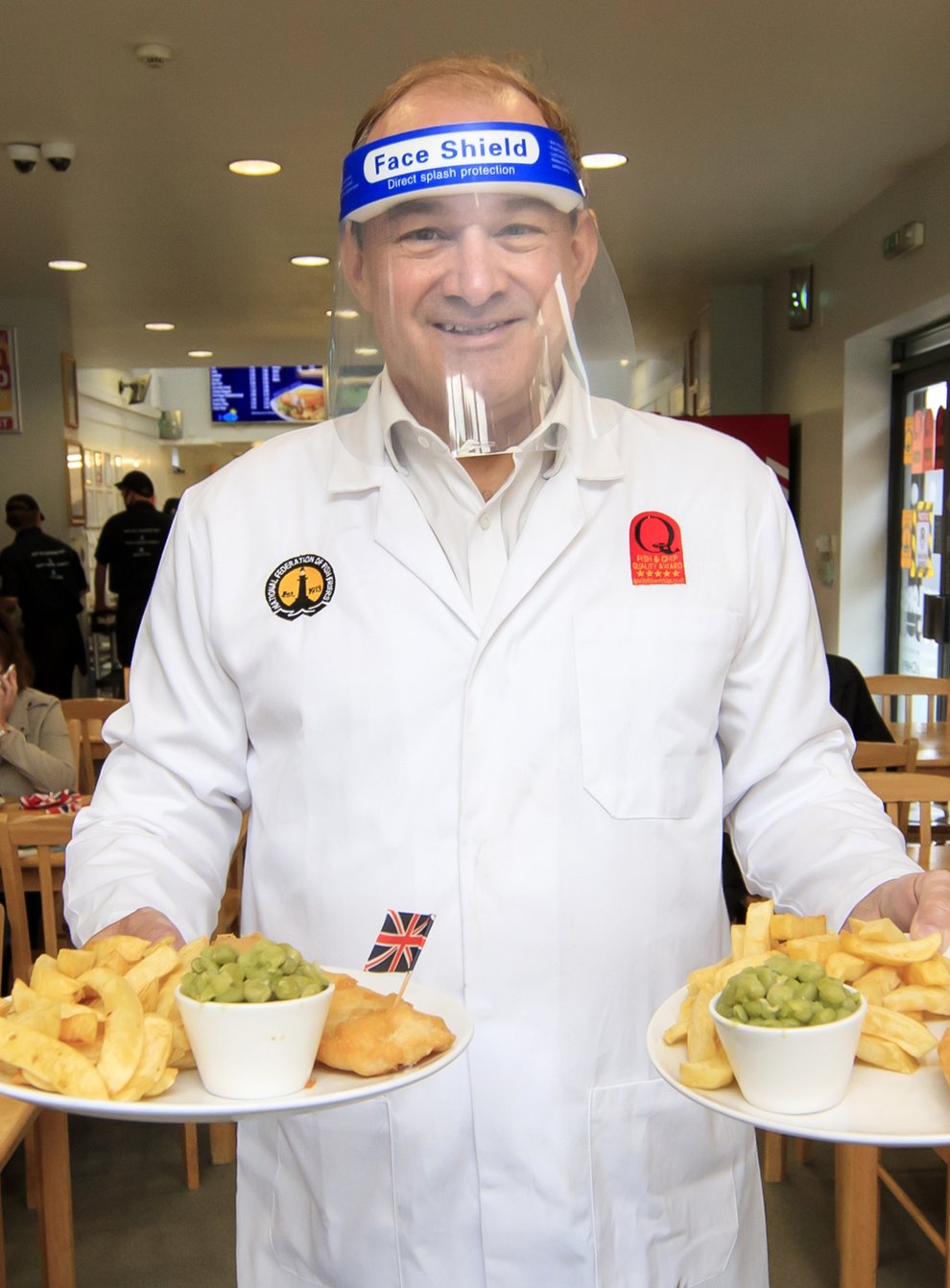 Sir Ed Davey puts in a shift at Taylors fish and chip shop in Stockport