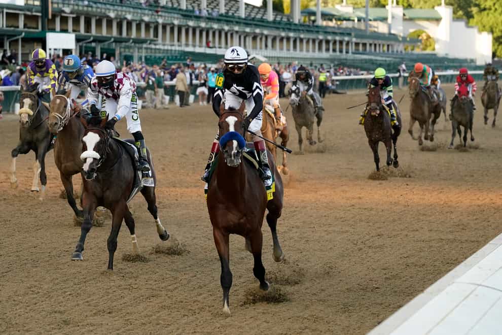 John Velazquez riding Authentic crosses the finish line to win the 146th running of the Kentucky Derby