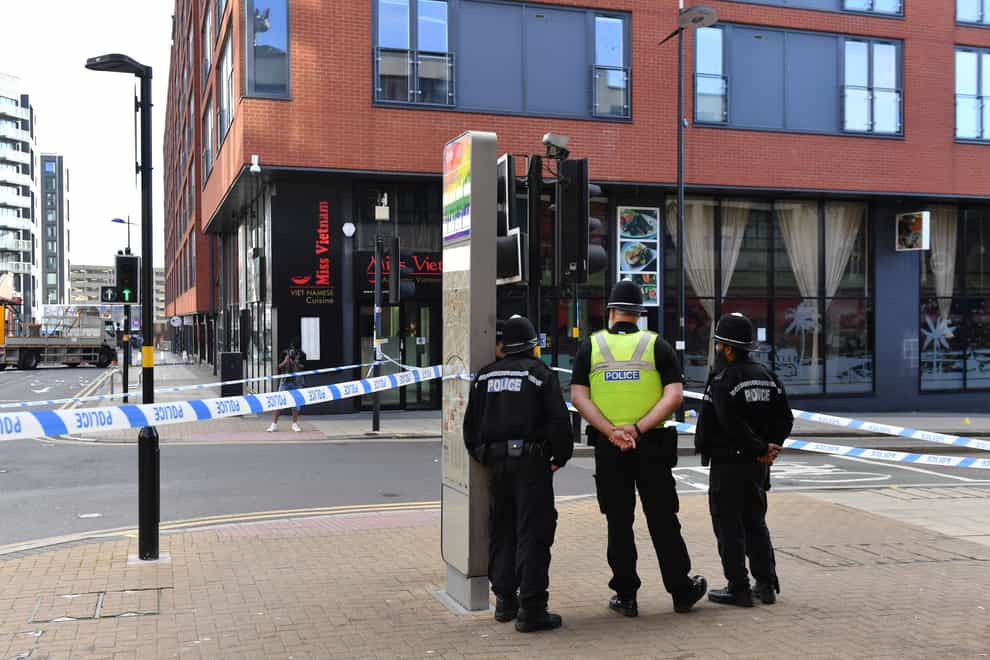 Police officers at a cordon in Hurst Street, one scene of the violence in Birmingham