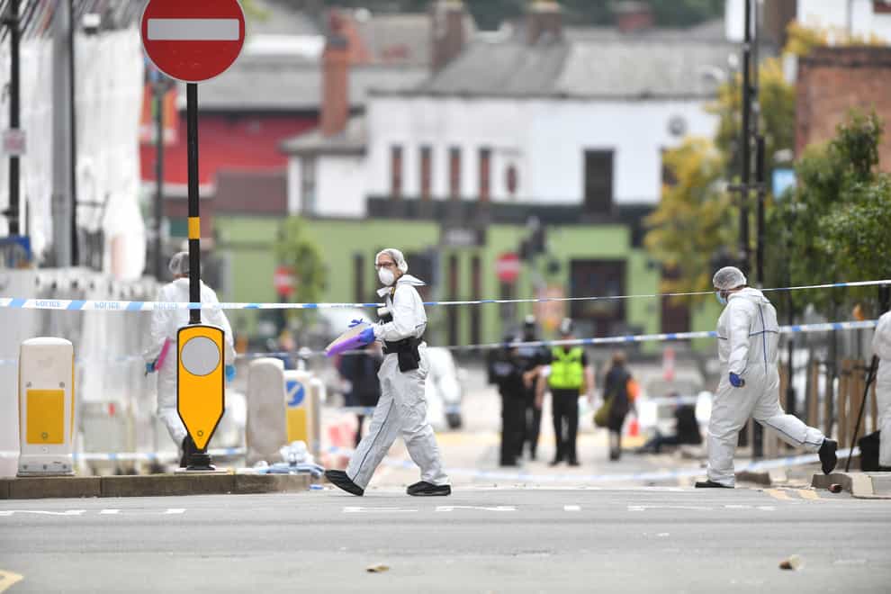 Police forensics officers at work in Hurst Street, in Birmingham (Jacob King/PA)