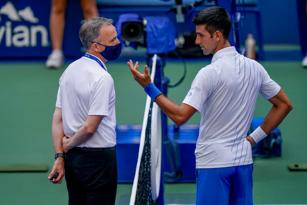 Novak Djokovic, right, talks to tournament referee Soeren Friemel