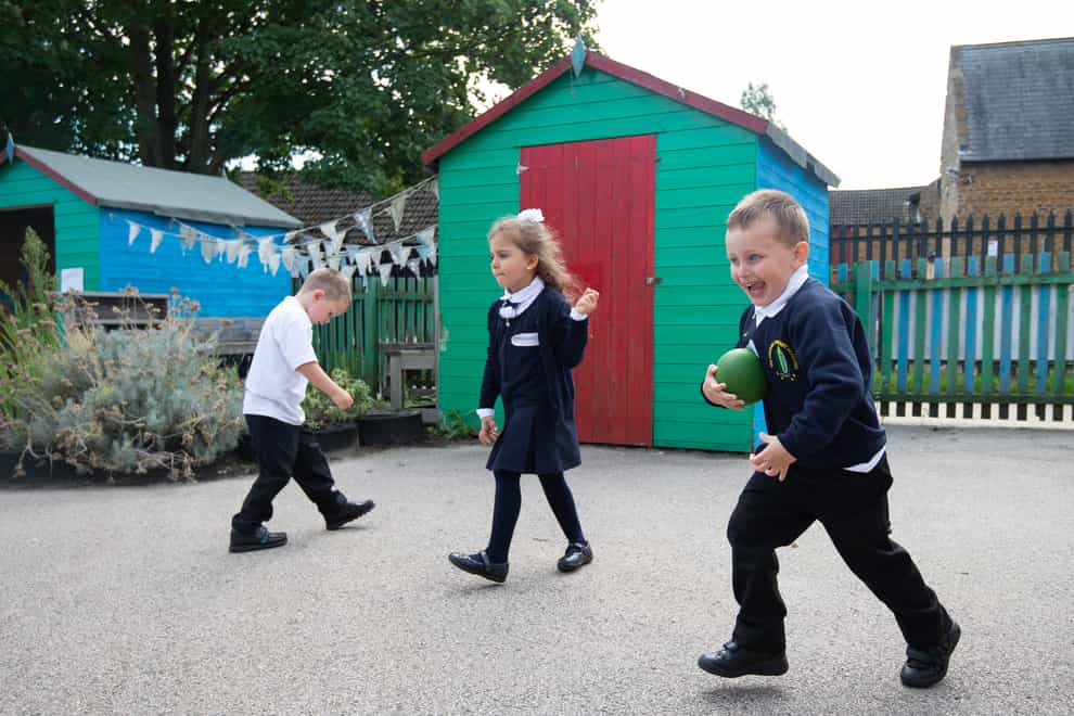 Children enjoy break time on the first day back to school at Arbours Primary Academy in Northampton