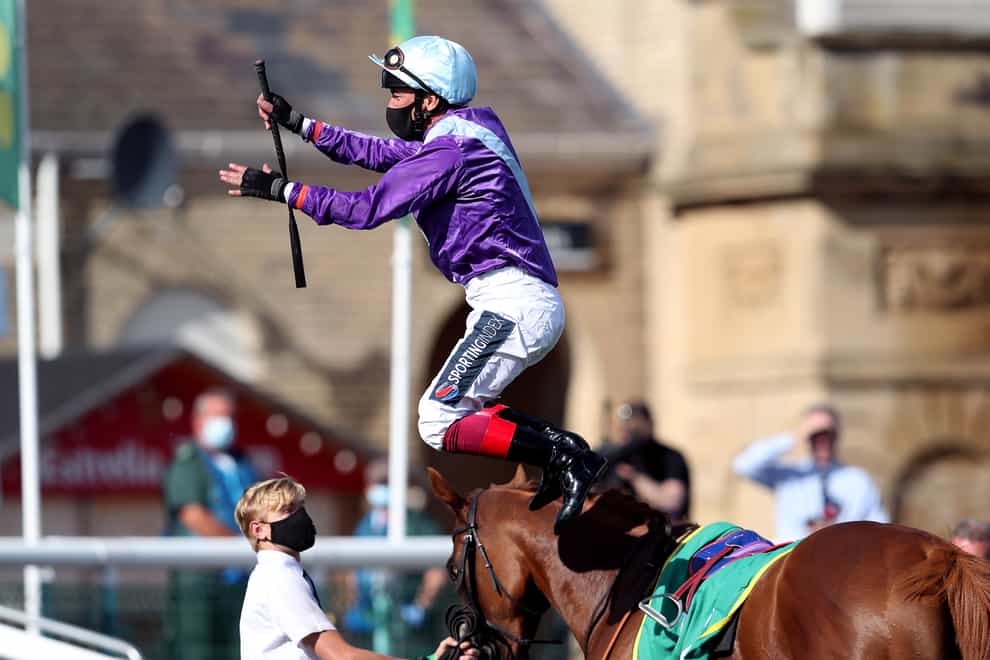 Frankie Dettori performs a flying dismount after winning the bet365 Sceptre Fillies’ Stakes on Foxtrot Lady