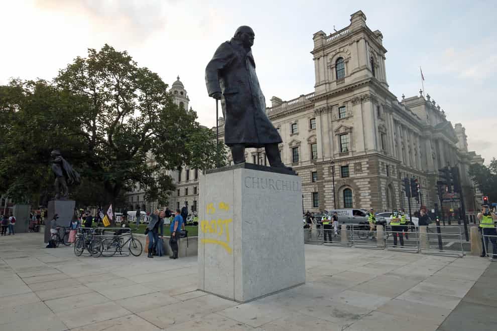The statue of Sir Winston Churchill after it was vandalised with the words in Parliament Square, London