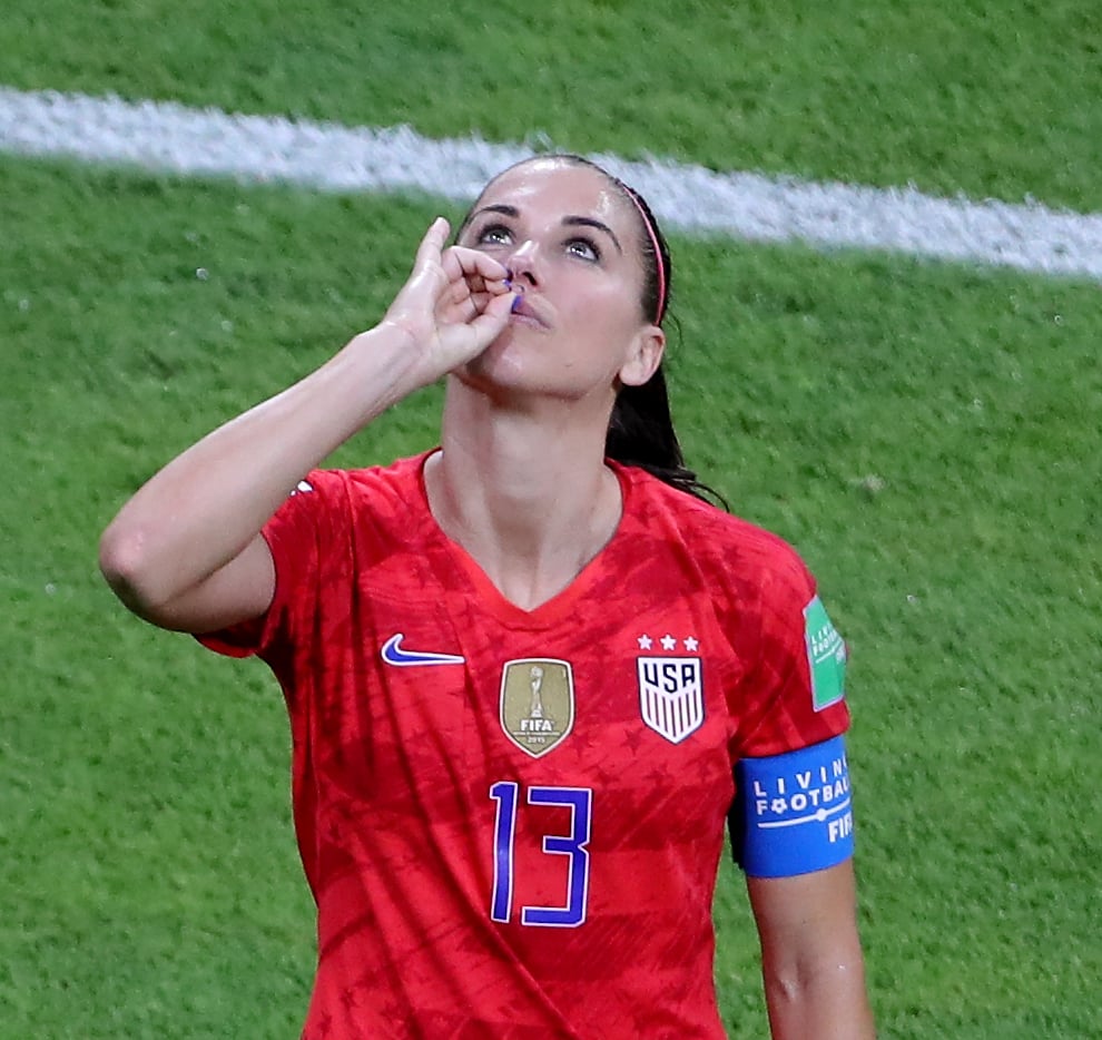 Morgan made a tea-drinking gesture as she celebrated scoring against England last year (Richard Sellers/PA).