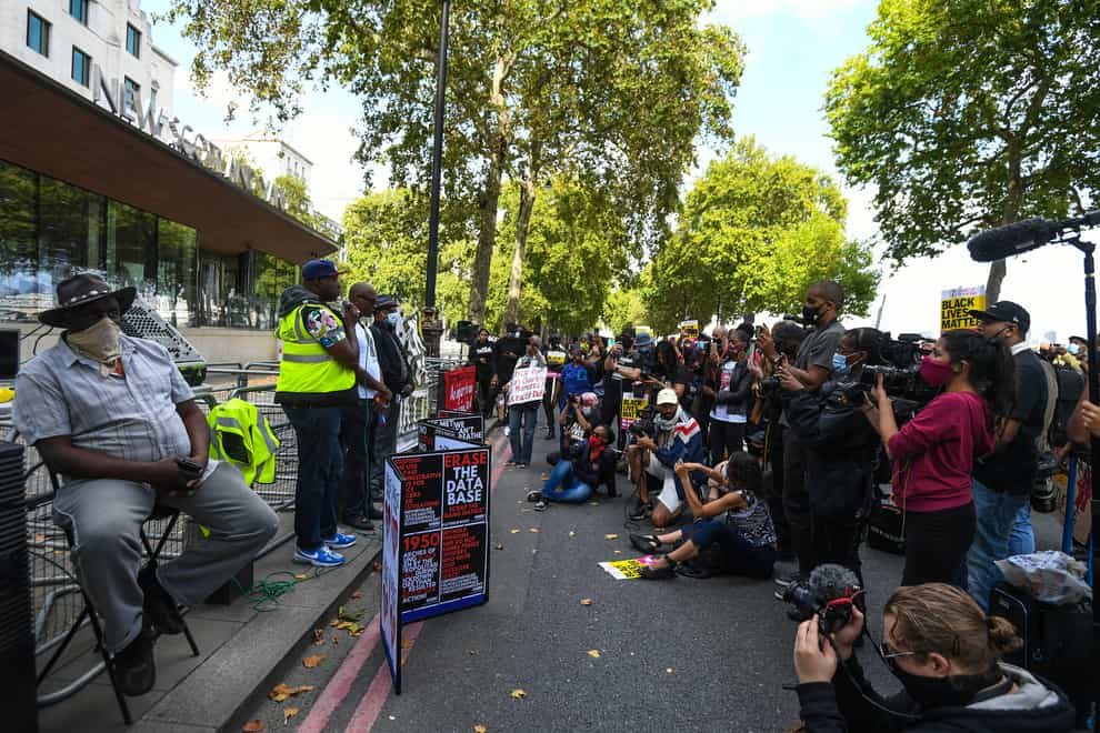 Protesters outside New Scotland Yard in London as part of an anti-racism demonstration calling for Commissioner Dame Cressida Dick to resign