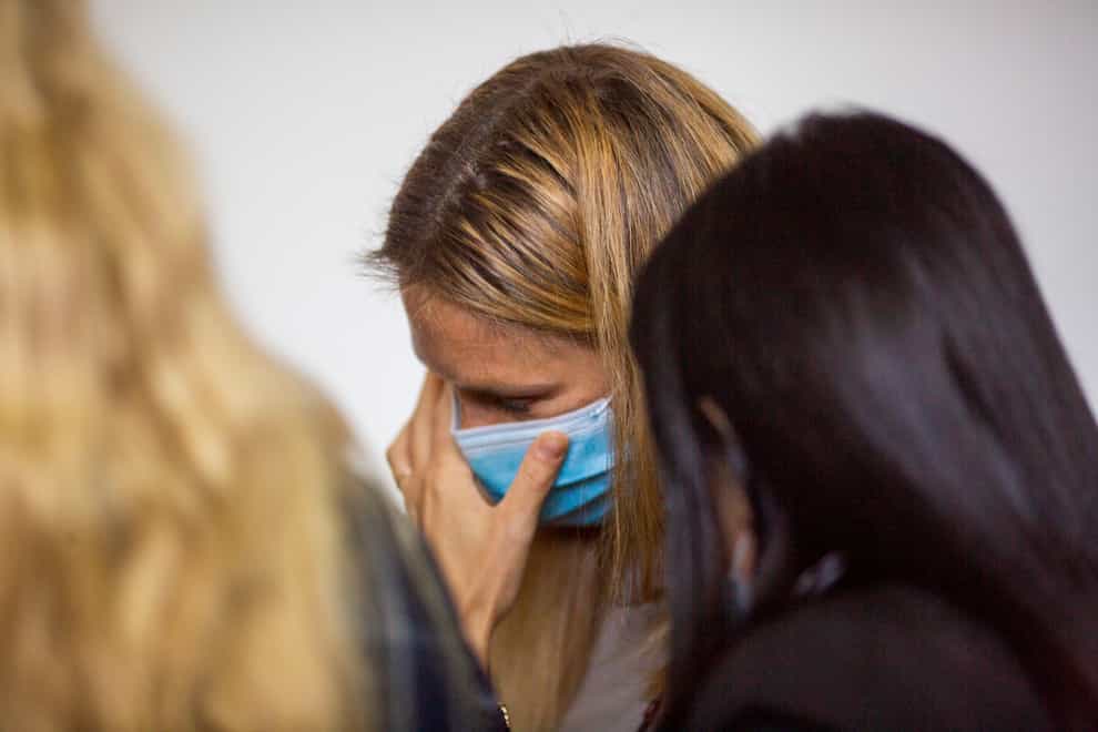 Bar Refaeli wears a face mask as she attends court