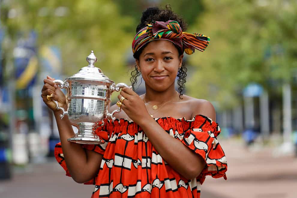 Naomi Osaka poses with the US Open trophy at Flushing Meadows on Sunday