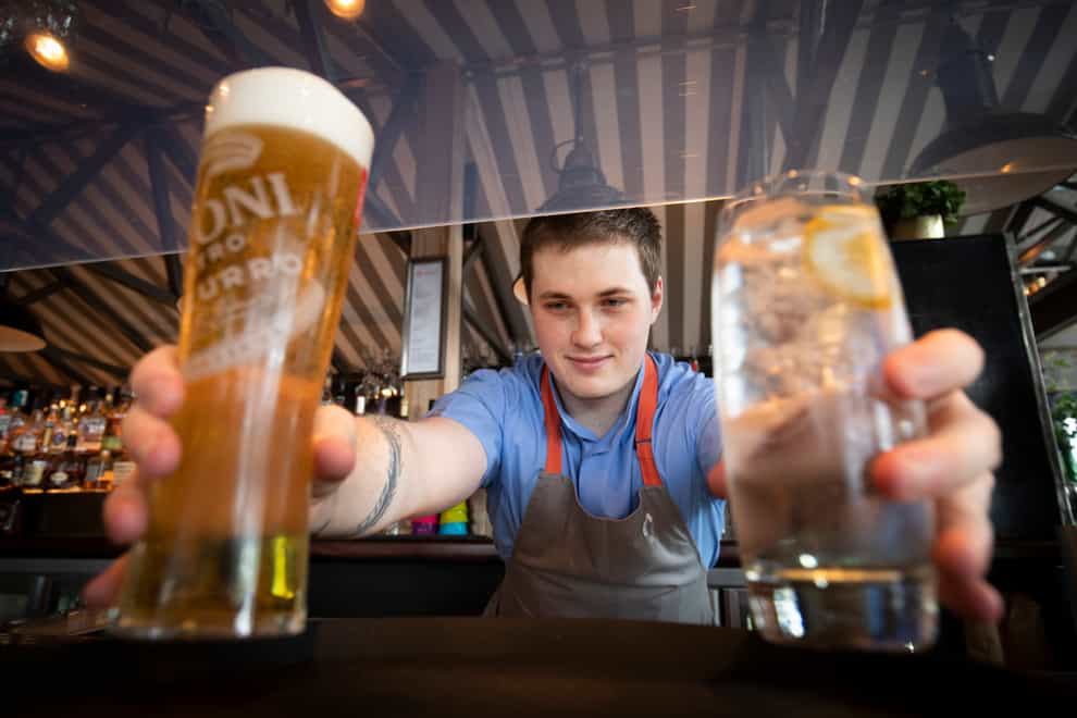 Barman Matthew Williams serves drinks at Scotts in South Queensferry