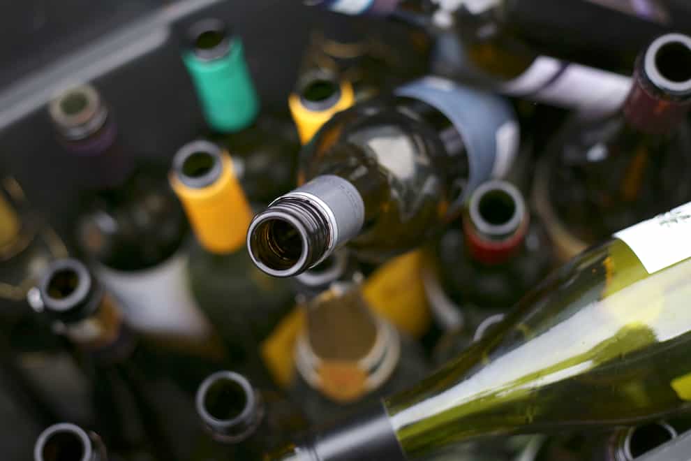 A recycling bin of empty wine bottles