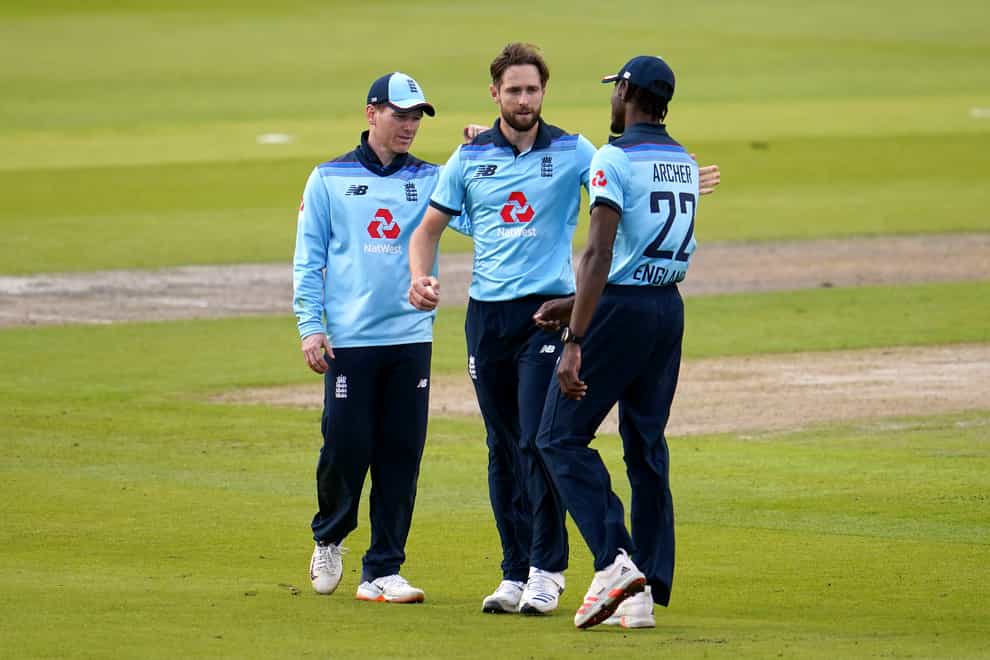 Chris Woakes (centre) says centrally-contracted players will feel impact after job cuts were announced