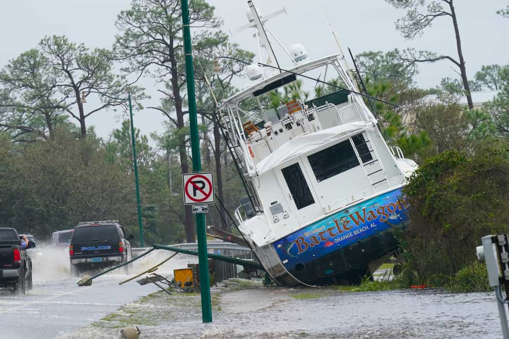 A boat washed up near a road