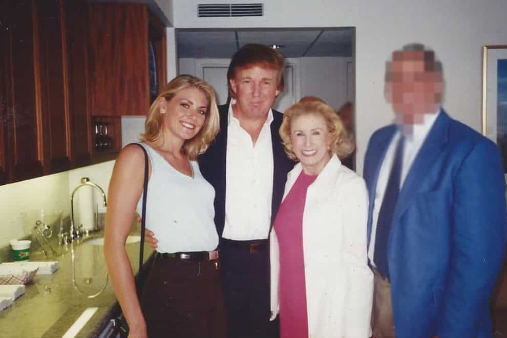 Amy Dorris, left, pictured at the US Open with Donald Trump in 1997