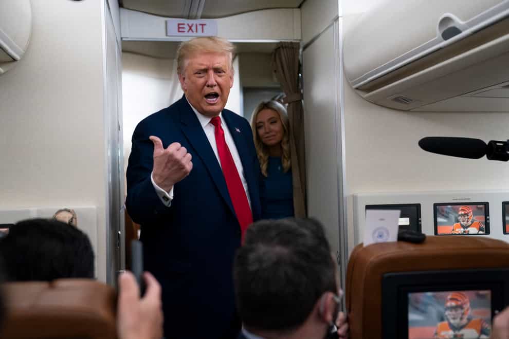 Donald Trump talks with reporters on Air Force One 