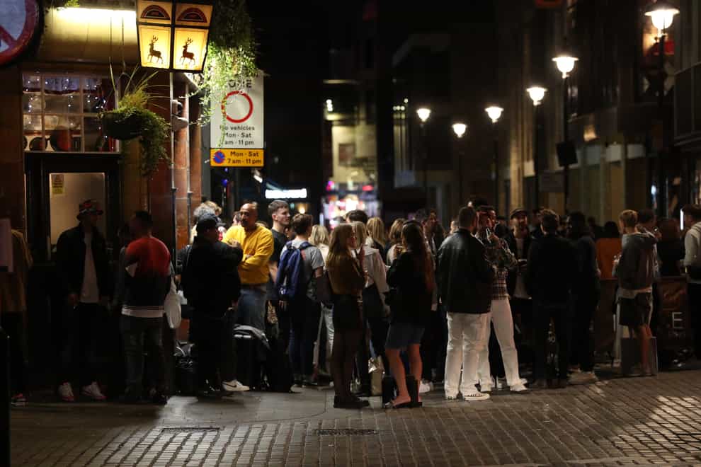 People outside the Blue Posts pub in Berwick Street, Soho