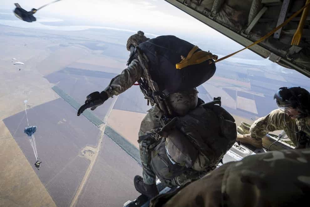 A member of the Pathfinders exiting the back of a Hercules C130 aircraft to parachute into Ukraine