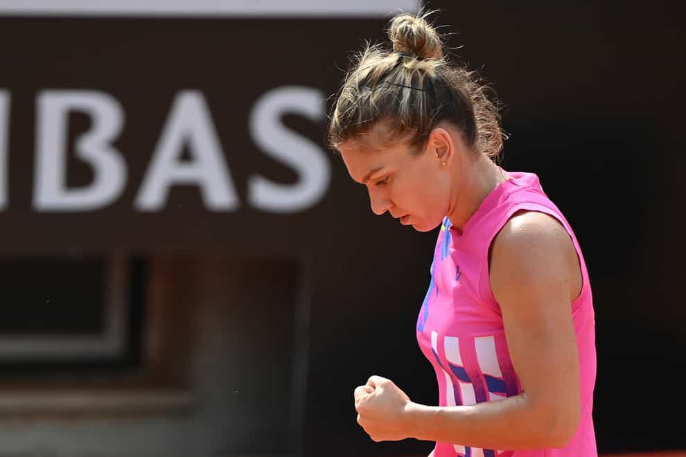 Simona Halep reacts to winning a point against Yulia Putintseva