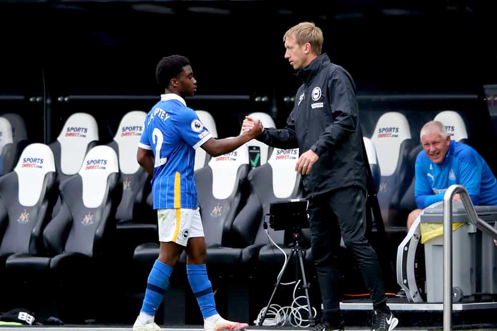 Brighton’s Tariq Lamptey (left) is congratulated by head coach Graham Potter after his starring performance at Newcastle