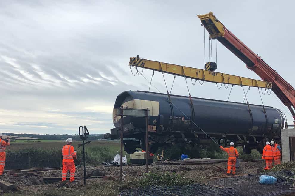 The derailment of a diesel-carrying freight train which led to a major fire happened after some of its wheels were damaged by a fault with the brakes, investigators said (Network Rail/PA)