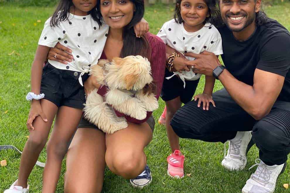 Sam Suriakumar with his wife and daughters