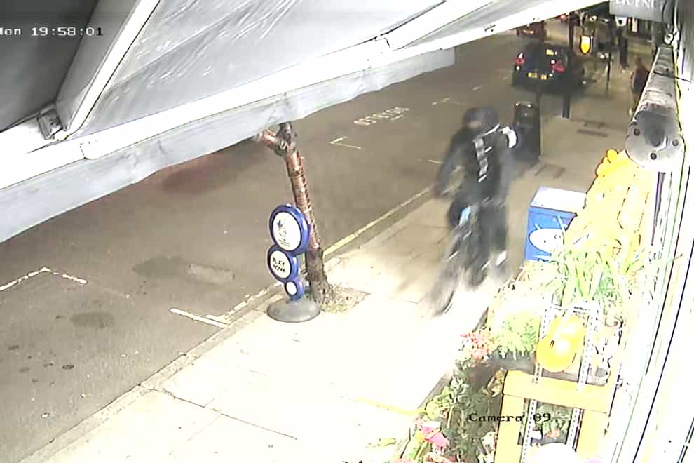 PoliceCCTV image of two suspects wanted in connection with the fatal stabbing of Kamal Nuur 