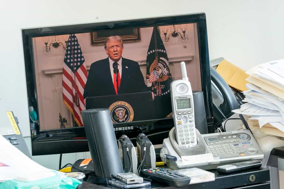 President Trump is seen on a video screen remotely addressing the 75th session of the United Nations General Assembly