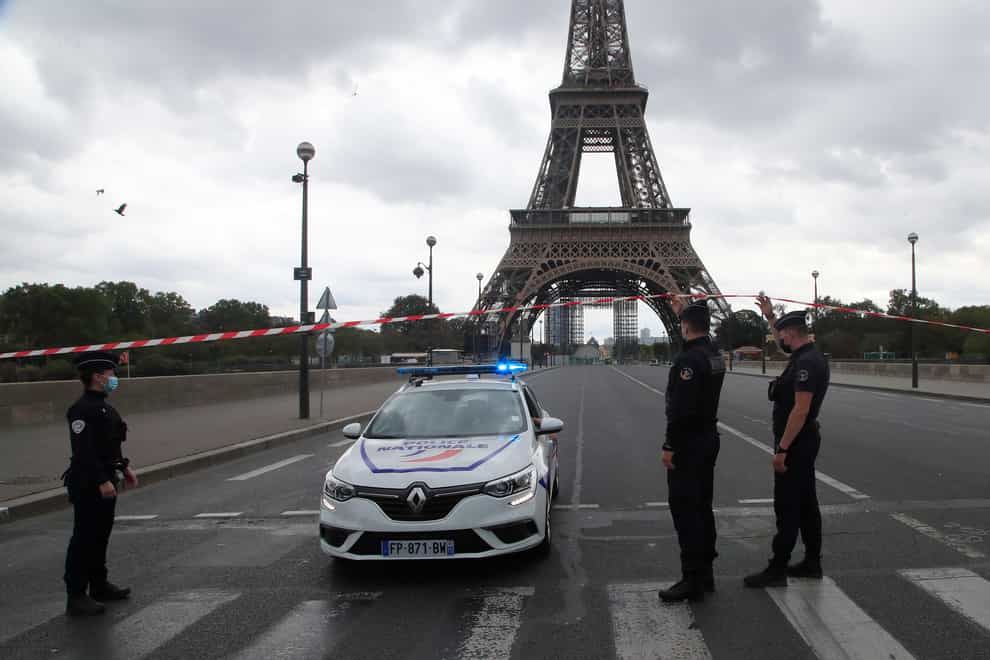 French police officers secure the bridge leading to the Eiffel Towe