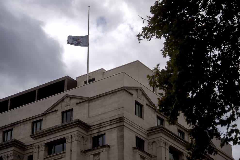 A flag flies at half mast on the roof of New Scotland Yard (Victoria Jones/PA)