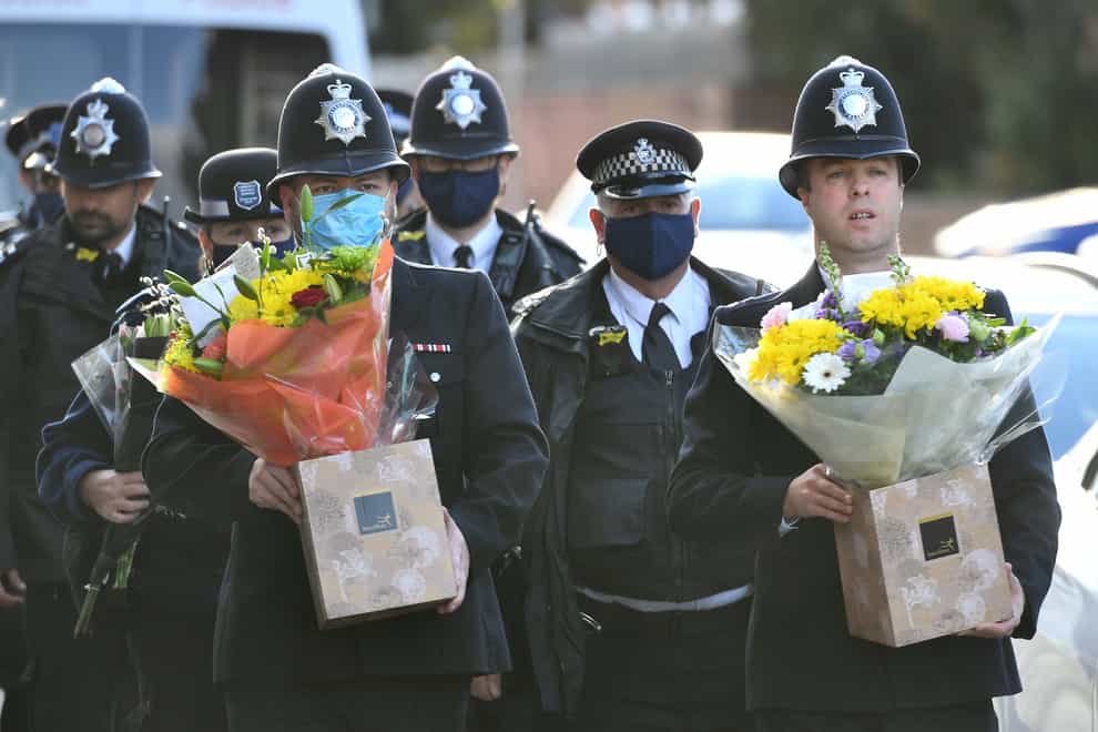 Floral tributes have been laid by police colleagues of Sergeant Matt Ratana (Dominic Lipinski/PA)