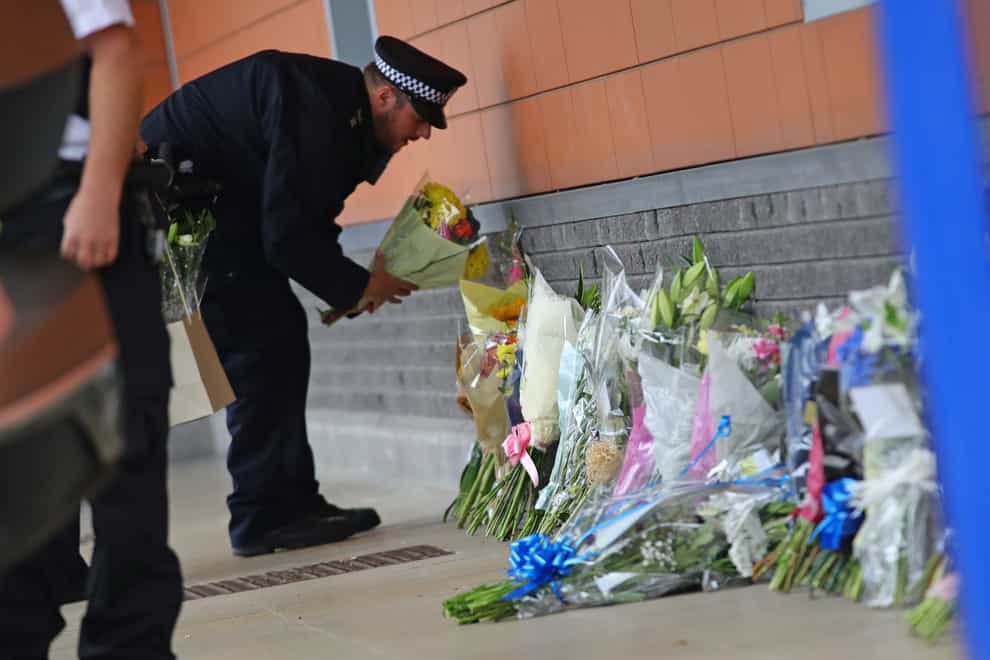 Floral tributes were laid outside Croydon Custody Centre in south London after an officer was shot and killed (Aaron Chown/PA)