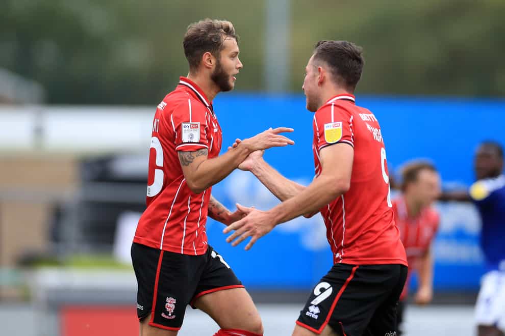 Jorge Grant, left, scored a controversial opener to help Lincoln to victory