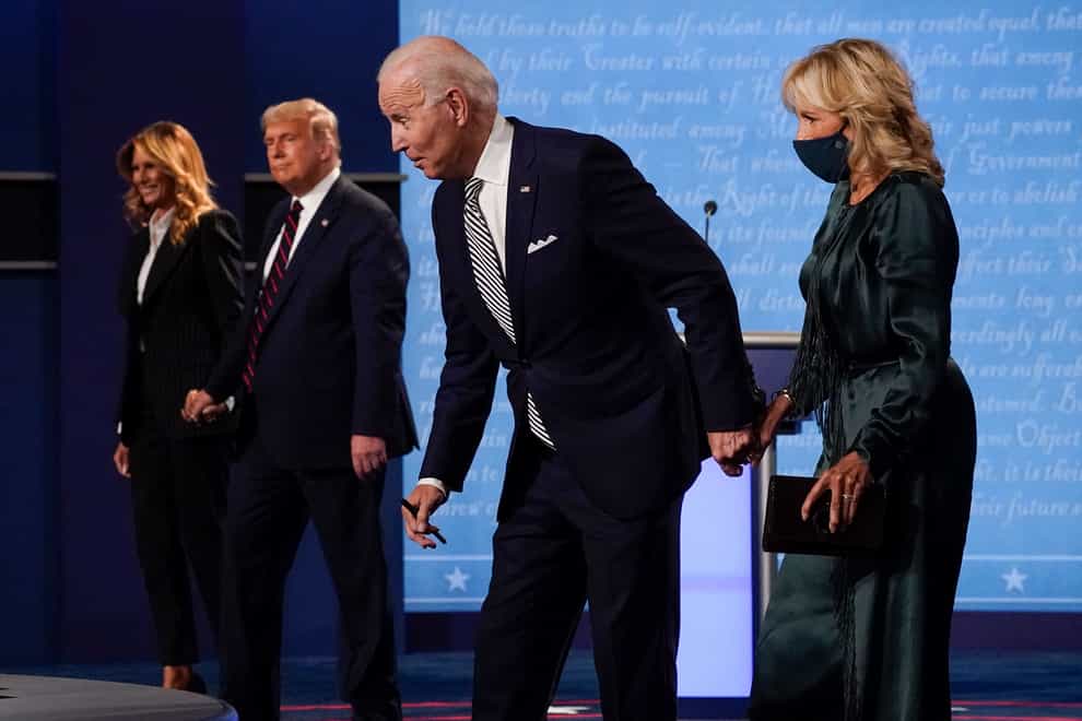 From l-r, first lady Melania Trump, President Donald Trump, Democratic presidential candidate former Vice President Joe Biden and Jill Biden, walk off stage at the conclusion of the first presidential debate