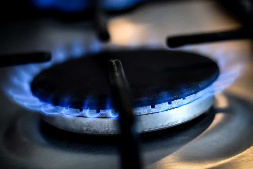 A lit gas ring on a domestic hob