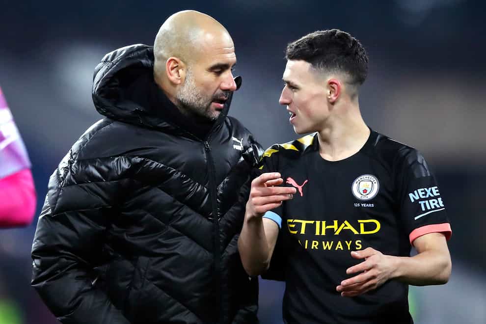 Pep Guardiola, left, and Phil Foden