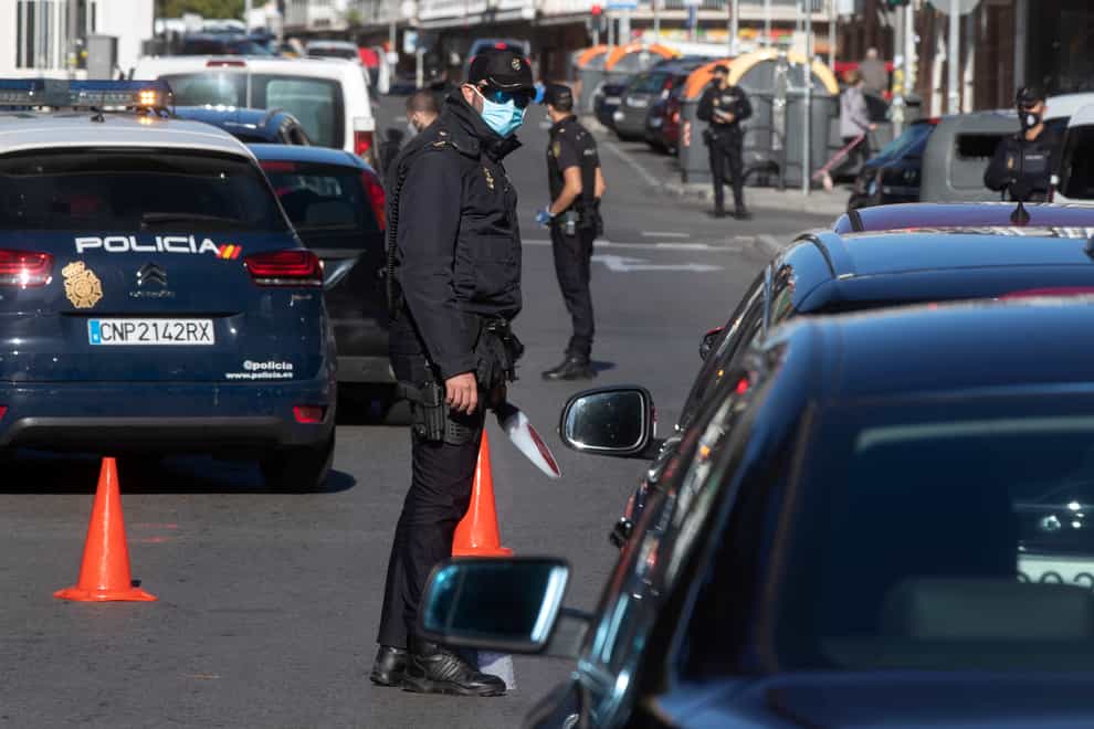 Police mount a checkpoint on the outskirts of Madrid