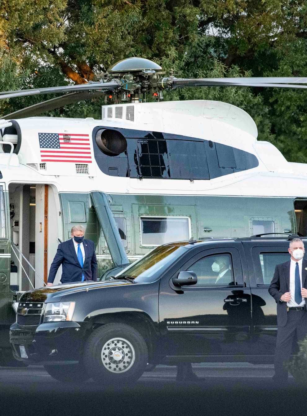 President Donald Trump arrives at Walter Reed Medical Center on Marine One for treatment after testing positive for Covid-19
