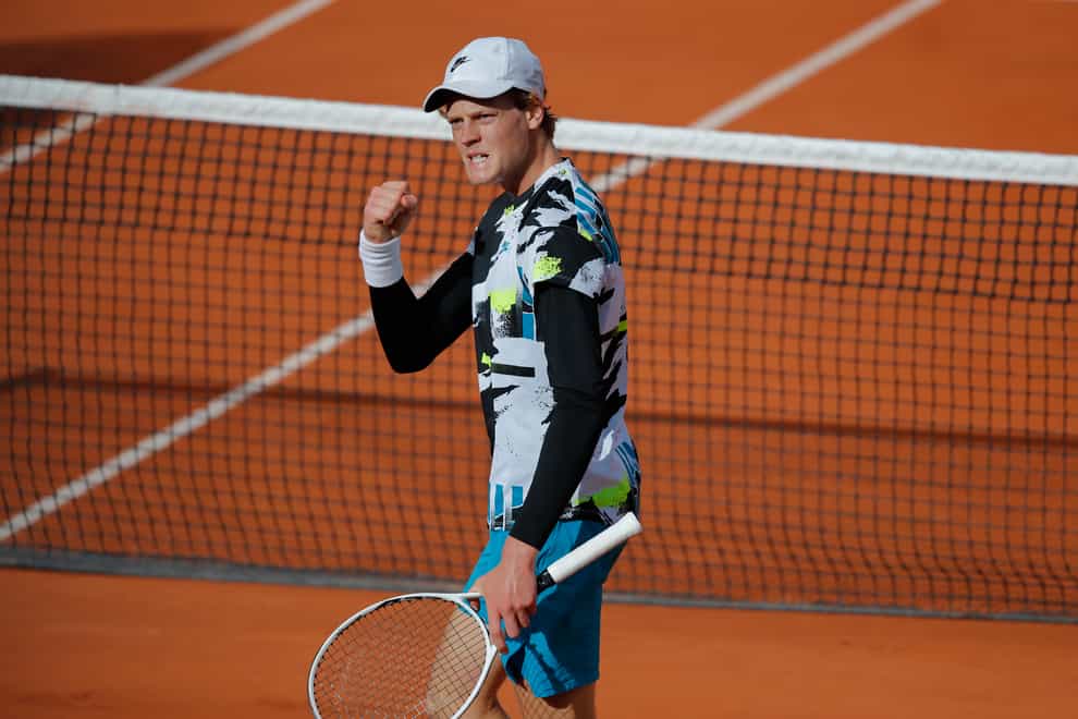 Jannik Sinner clenches his fist during his victory over Alexaner Zverev